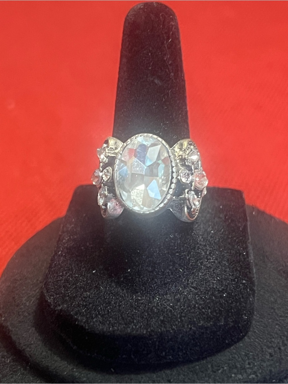 Silver-Tone Ring with Clear Oval Stone and Floral Accents